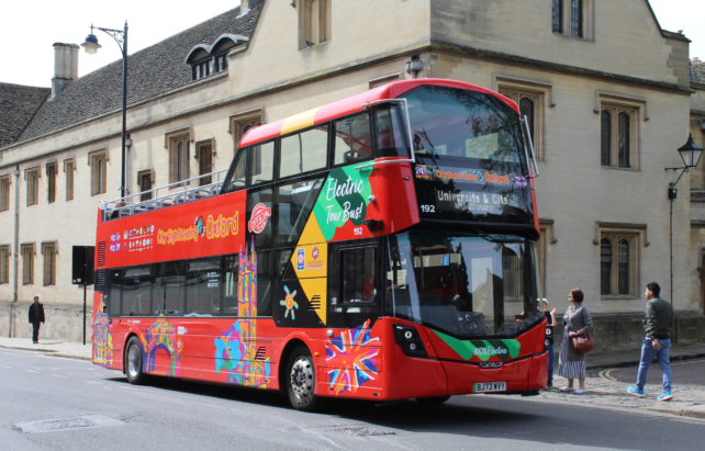 City Sightseeing Oxford Bus waiting for people to board the bus in St Aldates.